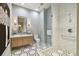 Elegant bathroom with modern vanity, shower, and geometric tile floors at 2910 W Barcelona St # 1901, Tampa, FL 33629