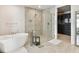 Spa-like bathroom featuring a soaking tub and walk-in shower at 2910 W Barcelona St # 1901, Tampa, FL 33629