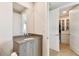 Elegant bathroom with a large vanity and walk-in closet at 2910 W Barcelona St # 1901, Tampa, FL 33629