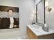Elegant bathroom featuring marble countertops and unique art at 2910 W Barcelona St # 1901, Tampa, FL 33629