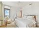 Spacious bedroom with large bed, window, and seating at 2910 W Barcelona St # 1901, Tampa, FL 33629