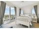 Comfortable bedroom with large windows and access to a balcony at 2910 W Barcelona St # 1901, Tampa, FL 33629