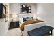 Modern bedroom with white bed frame and artistic accents at 2910 W Barcelona St # 1901, Tampa, FL 33629