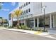 Modern building exterior with palm trees and landscaping at 2910 W Barcelona St # 1901, Tampa, FL 33629