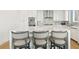 Modern kitchen with white cabinetry and breakfast bar seating at 2910 W Barcelona St # 1901, Tampa, FL 33629