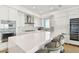 Modern kitchen with white cabinets and island seating at 2910 W Barcelona St # 1901, Tampa, FL 33629