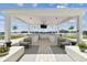 Covered outdoor lounge with TV and seating at 2910 W Barcelona St # 1901, Tampa, FL 33629