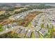 An aerial view of a suburban neighborhood with several homes at 2950 Lytton Hall Dr, Zephyrhills, FL 33540