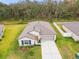 Charming single-story home with a two-car garage and landscaped front yard at 2950 Lytton Hall Dr, Zephyrhills, FL 33540