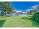 View of the backyard with screened pool at 39093 Citadel Cir, Zephyrhills, FL 33542