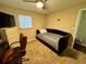 Cozy bedroom with a daybed and a dresser at 39093 Citadel Cir, Zephyrhills, FL 33542