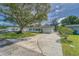 Single-story home with driveway and landscaping at 39093 Citadel Cir, Zephyrhills, FL 33542