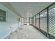 Screened-in porch with concrete floor at 39093 Citadel Cir, Zephyrhills, FL 33542