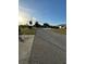 Residential street view with homes and clear skies at 39093 Citadel Cir, Zephyrhills, FL 33542