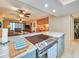 Modern kitchen with stainless steel appliances and light teal cabinets at 407 Tarpon Pt # 407, Tarpon Springs, FL 34689