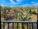 Balcony view overlooking lush trees and greenery for a peaceful outdoor retreat at 407 Tarpon Pt # 407, Tarpon Springs, FL 34689