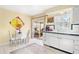 Kitchen with white cabinets and a breakfast nook at 5005 Lily Street N Pl, Pinellas Park, FL 33782
