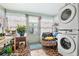 Laundry room with washer, dryer, and plants at 5005 Lily Street N Pl, Pinellas Park, FL 33782