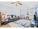 Living room with hardwood floors, comfy seating, and access to front door at 5005 Lily Street N Pl, Pinellas Park, FL 33782