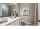 Clean bathroom with a vanity, shower, and modern fixtures at 5132 Slate Hue Pl, Apollo Beach, FL 33572