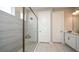 Modern bathroom with walk-in shower and double vanity at 5132 Slate Hue Pl, Apollo Beach, FL 33572