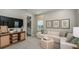 Cozy Gathering room featuring a comfortable sectional sofa and built-in entertainment center at 5132 Slate Hue Pl, Apollo Beach, FL 33572