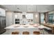 Modern kitchen with island, stainless steel appliances, and white cabinets at 5132 Slate Hue Pl, Apollo Beach, FL 33572