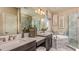 Elegant bathroom with a soaking tub and double vanity at 5136 Slate Hue Pl, Apollo Beach, FL 33572