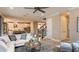 Open living room with a sectional sofa and view of staircase at 5136 Slate Hue Pl, Apollo Beach, FL 33572