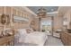 Luxurious main bedroom with plush bedding and private balcony access at 5136 Slate Hue Pl, Apollo Beach, FL 33572