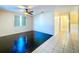 Living room with dark hardwood floors and view of hallway at 5413 15Th S Ave, Gulfport, FL 33707