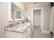 Spa-like bathroom with granite countertop and white cabinets at 550 Boca Ciega Point N Blvd, St Petersburg, FL 33708