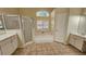 Bathroom features a large soaking tub and double vanity at 6013 Catlin Dr, Tampa, FL 33647