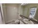 Bathroom features a shower, toilet and vanity at 6013 Catlin Dr, Tampa, FL 33647