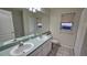 Bathroom with double sinks and tile flooring at 6013 Catlin Dr, Tampa, FL 33647