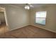 Bedroom with ceiling fan and carpet flooring at 6013 Catlin Dr, Tampa, FL 33647
