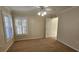 Well-lit bedroom with carpet flooring and window shutters at 6013 Catlin Dr, Tampa, FL 33647