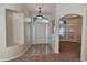 Bright entryway with tiled floor, neutral walls, and access to other rooms at 6013 Catlin Dr, Tampa, FL 33647