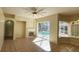 Spacious Gathering room with fireplace and sliding doors to the pool at 6013 Catlin Dr, Tampa, FL 33647