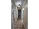 Home hallway with tile flooring and access to rooms at 6013 Catlin Dr, Tampa, FL 33647