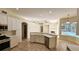 Bright kitchen features stainless steel appliances and an island at 6013 Catlin Dr, Tampa, FL 33647