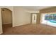 Open living area with pool view and access to other rooms at 6013 Catlin Dr, Tampa, FL 33647