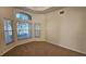 Bright office with large windows and neutral colored carpet at 6013 Catlin Dr, Tampa, FL 33647