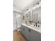 Double vanity bathroom with updated fixtures and flooring at 6211 Timber Lake Dr # B8, Sarasota, FL 34243