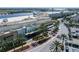 Aerial view of a shopping center with palm trees and ample parking at 6211 Timber Lake Dr # B8, Sarasota, FL 34243
