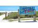 Siesta Beach entrance sign with beach view at 6211 Timber Lake Dr # B8, Sarasota, FL 34243