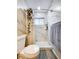 Updated bathroom with walk-in shower and marble tile at 6321 Staunton Dr, Holiday, FL 34690