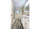 Modern bathroom with a marble countertop vanity, a shower, and neutral paint at 6321 Staunton Dr, Holiday, FL 34690
