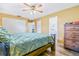 Bright bedroom featuring a large bed and ample closet space at 6321 Staunton Dr, Holiday, FL 34690