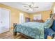 Spacious bedroom with wood flooring and a ceiling fan at 6321 Staunton Dr, Holiday, FL 34690